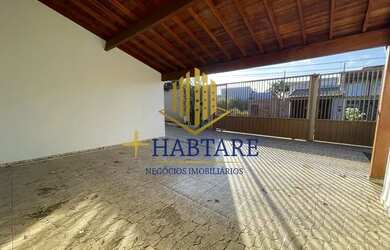 Imagem: A casa possui 3 Dormitórios, 4 Banheiros, 4 Vagas na garagem