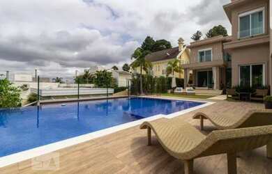 Imagem: A casa em condomínio possui 5 Dormitórios, 5 Banheiros, 3