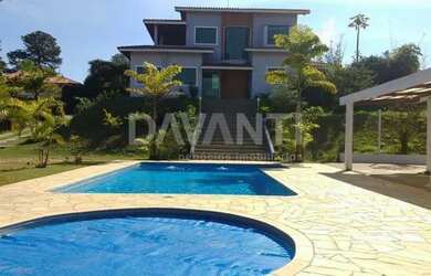 Imagem: A casa em condomínio possui 4 Dormitórios, 5 Banheiros, 2