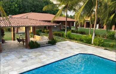 Imagem: A casa possui 4 Dormitórios, 5 Banheiros, 5 Vagas na garagem