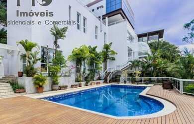 Imagem: A casa possui 5 Dormitórios, 5 Banheiros, 5 Vagas na garagem