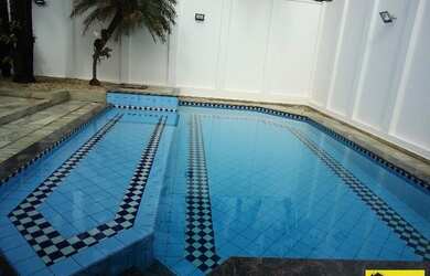 Imagem: A casa em condomínio à venda possui 4 Dormitórios, 5 Banheiros