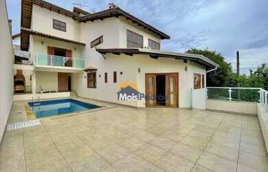 Imagem: A casa em condomínio possui 4 Dormitórios, 5 Banheiros, 5