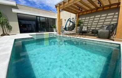 Imagem: A casa possui 3 Dormitórios, 5 Banheiros, 2 Vagas na garagem