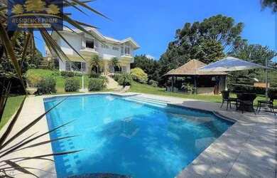 Imagem: A casa em condomínio possui 4 Dormitórios, 5 Banheiros, 5