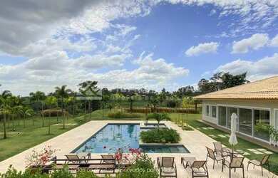 Imagem: A casa possui 5 Dormitórios, 5 Banheiros, 5 Vagas na garagem