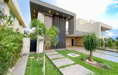 Imagem: A casa possui 4 Dormitórios, 5 Banheiros, 4 Vagas na garagem