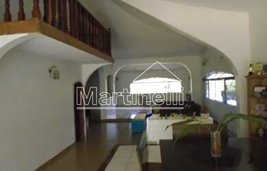 Imagem: A casa possui 3 Dormitórios, 5 Banheiros, 5 Vagas na garagem