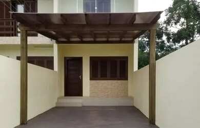 Imagem: A casa possui 2 Dormitórios, 2 Banheiros, 2 Vagas na garagem