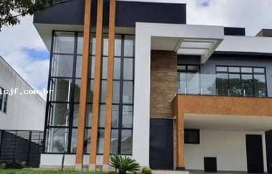 Imagem: A casa possui 4 Dormitórios, 5 Banheiros, 4 Vagas na garagem