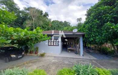 Imagem: A casa possui 3 Dormitórios, 2 Banheiros, 2 Vagas na garagem