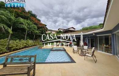 Imagem: A casa possui 5 Dormitórios, 5 Banheiros, 3 Vagas na garagem