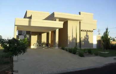 Imagem: A casa possui 3 Dormitórios, 5 Banheiros, 4 Vagas na garagem