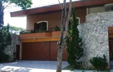 Imagem: A casa possui 5 Dormitórios, 5 Banheiros, 5 Vagas na garagem