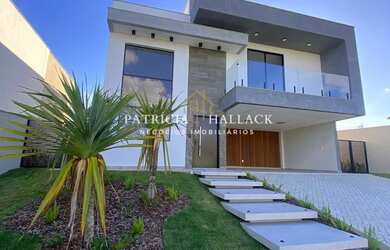 Imagem: A casa possui 4 Dormitórios, 5 Banheiros, 4 Vagas na garagem