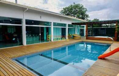 Imagem: A casa possui 5 Dormitórios, 5 Banheiros, 5 Vagas na garagem