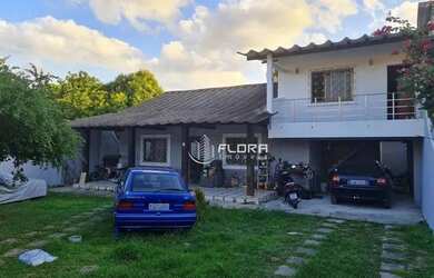 Imagem: A casa possui 4 Dormitórios, 3 Banheiros, 3 Vagas na garagem