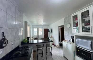 Imagem: A casa possui 2 Dormitórios, 2 Banheiros e está localizado