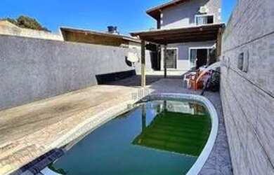 Imagem: A casa possui 2 Dormitórios, 3 Banheiros, 5 Vagas na garagem