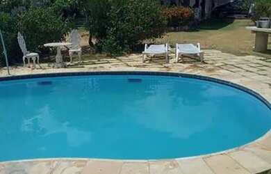 Imagem: A casa possui 5 Dormitórios, 3 Vagas na garagem e está localizado