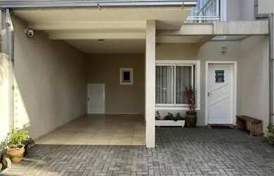 Imagem: A casa possui 3 Dormitórios, 3 Banheiros, 3 Vagas na garagem