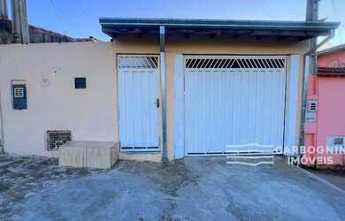 Imagem: A casa possui 3 Dormitórios, 2 Banheiros, 2 Vagas na garagem