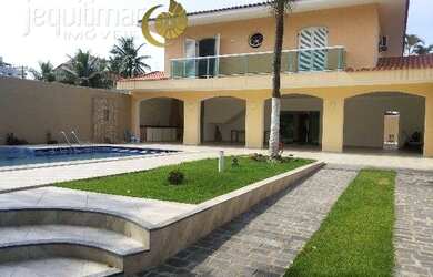 Imagem: A casa possui 4 Dormitórios, 5 Banheiros, 5 Vagas na garagem