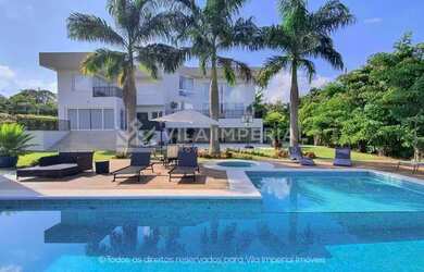 Imagem: A casa possui 5 Dormitórios, 5 Banheiros, 5 Vagas na garagem