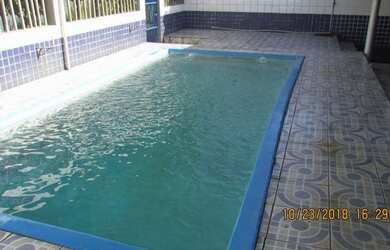 Imagem: A casa possui 5 Dormitórios, 3 Banheiros, 4 Vagas na garagem