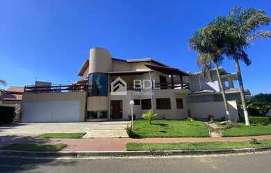 Imagem: A casa em condomínio possui 5 Dormitórios, 5 Banheiros, 4