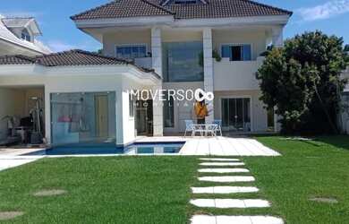 Imagem: A casa possui 4 Dormitórios, 5 Banheiros, 4 Vagas na garagem