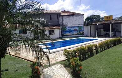 Imagem: A casa possui 4 Dormitórios, 3 Banheiros, 5 Vagas na garagem