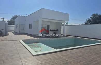 Imagem: A casa possui 4 Dormitórios, 4 Banheiros, 4 Vagas na garagem