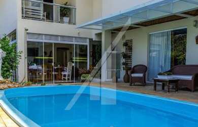 Imagem: A casa possui 4 Dormitórios, 5 Banheiros, 5 Vagas na garagem