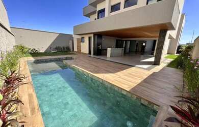 Imagem: A casa possui 5 Dormitórios, 5 Banheiros, 5 Vagas na garagem