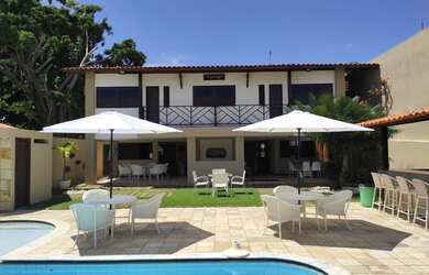 Imagem: A casa possui 4 Dormitórios, 3 Vagas na garagem e está localizado