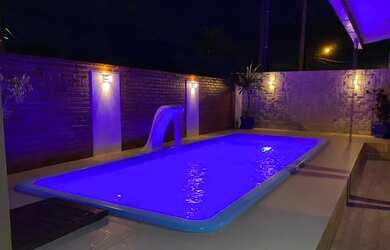 Imagem: A casa possui 3 Dormitórios, 3 Vagas na garagem e está localizado