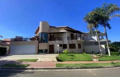 Imagem: A casa possui 5 Dormitórios, 4 Banheiros, 5 Vagas na garagem