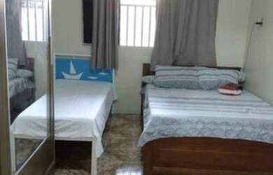 Imagem: A casa possui 3 Dormitórios, 2 Banheiros, 3 Vagas na garagem