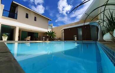 Imagem: A casa possui 5 Dormitórios, 5 Banheiros, 5 Vagas na garagem