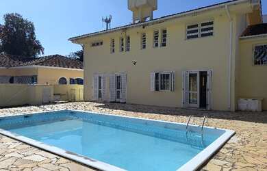 Imagem: A casa possui 5 Dormitórios, 5 Banheiros, 5 Vagas na garagem