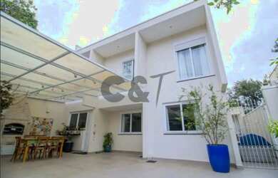 Imagem: A casa possui 3 Dormitórios, 4 Banheiros, 3 Vagas na garagem