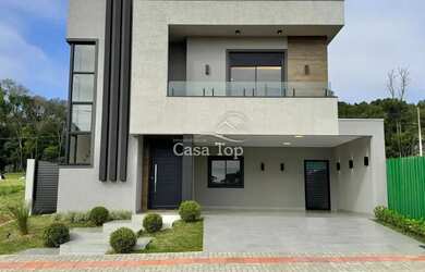 Imagem: A casa em condomínio possui 4 Dormitórios, 4 Banheiros, 2