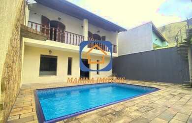 Imagem: A casa possui 5 Dormitórios, 5 Banheiros, 5 Vagas na garagem