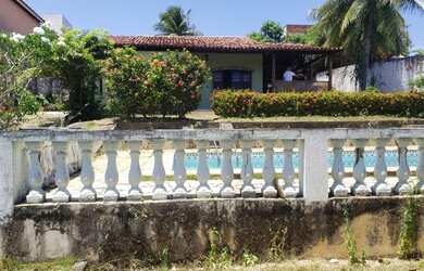 Imagem: A casa e possui 4 Dormitórios, 4 Banheiros, 5 Vagas na garagem