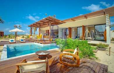 Imagem: A casa possui 3 Dormitórios, 5 Banheiros, 3 Vagas na garagem