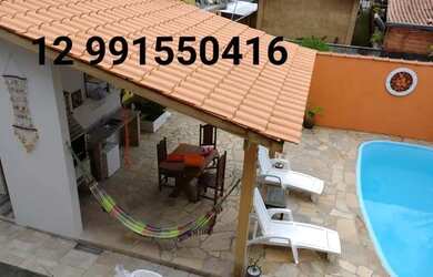 Imagem: A casa possui 2 Dormitórios, 2 Vagas na garagem e está localizado