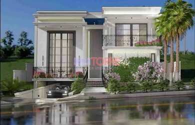 Imagem: A casa em condomínio possui 4 Dormitórios, 5 Banheiros, 405m²