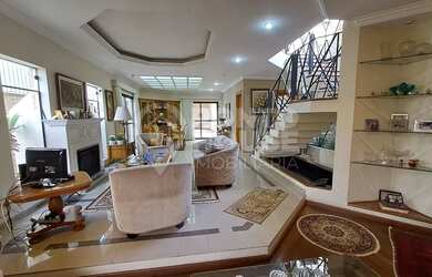 Imagem: A casa possui 3 Dormitórios, 4 Banheiros, 4 Vagas na garagem