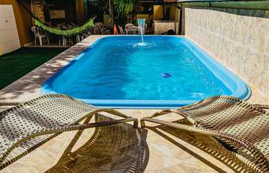 Imagem: A casa possui 4 Dormitórios, 2 Vagas na garagem e está localizado